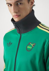 adidas Originals JAMAICA JFF BECKENBAUER TRACK - Equipación de selecciones - court green