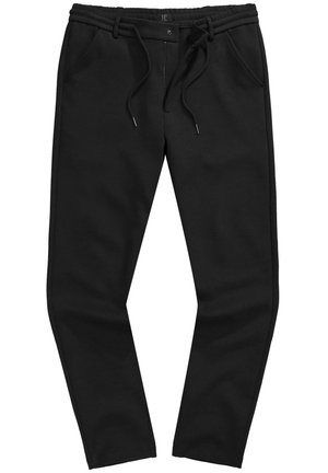 Pantalones jogger negros de corte relajado, confeccionados en una tela suave que presenta una cintura con cordón, bolsillos laterales y detalles de costura en contraste.