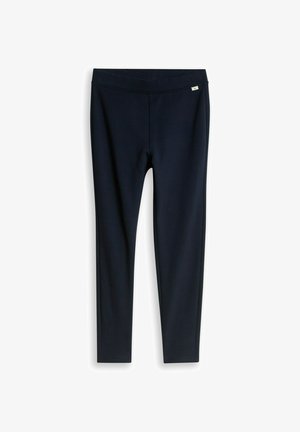 Zwarte slim-fit leggings met een klein wit logo-label bij de tailleband op een witte achtergrond.