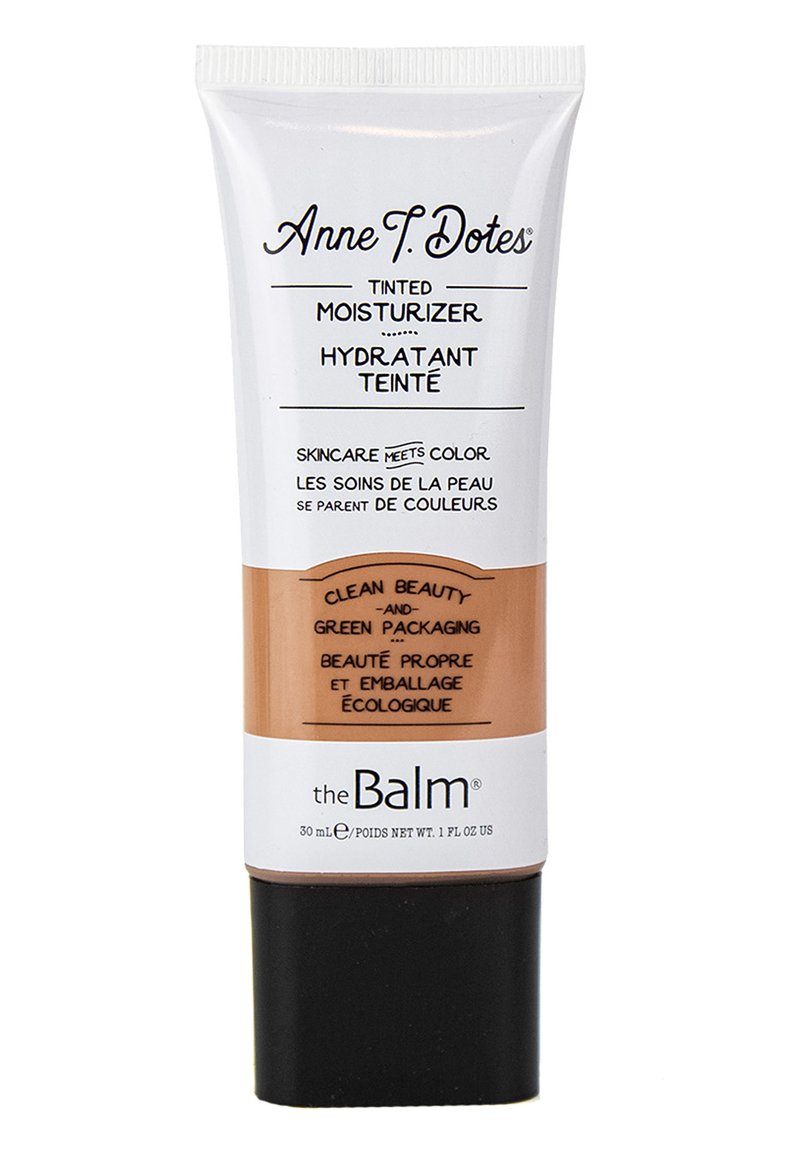 Crema idratante colorata in un tubo cilindrico con parte superiore bianca, centro marrone e parte inferiore nera. Il testo in nero evidenzia la bellezza pulita e il packaging ecologico.