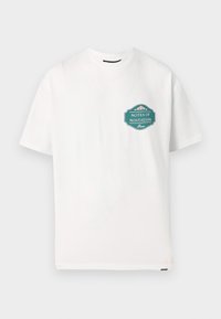 White cotton t-shirt with short sleeves. Features a teal graphic print reading "NOTES OF NOSTALGIA" on the front in a badge layout.