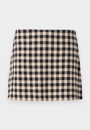 Black and cream checkered skirt with a straight cut, featuring a smooth texture and a hem that sits above the knee. No hardware or accents.