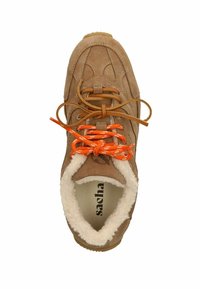 Brown suede sneaker with orange and white laces, fur-lined collar, and a textured sole. Features subtle stitching patterns.