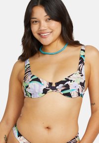 Top bikini floreale nero, con un mix di foglie viola chiaro e verdi. Coppe sagomate con spalline regolabili. Tessuto texturizzato.