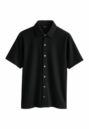 Kortärmad svart skjorta i ribbat material, med knäppning framtill med silverknappar och klassisk krage.
