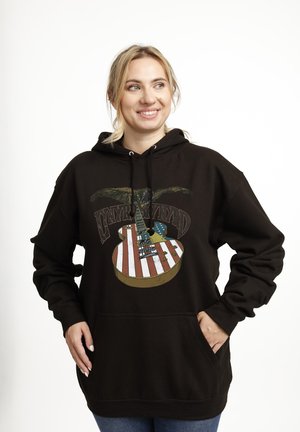 Black cotton hoodie featuring a graphic of a guitar with an American flag design, including an eagle, front pocket, and drawstring hood.
