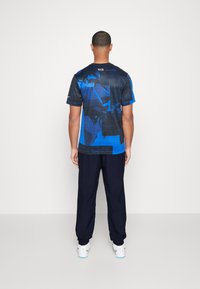 Nike Performance NIKE ACADEMY23 TRACK PANTS - Træningsbukser - obsidian/obsidian/white