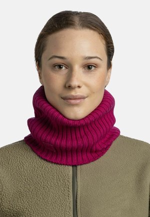 Fuchsia ribbed knit neck warmer with a high, wide collar. Worn over a beige fleece top, featuring a small brand label at the collar.
