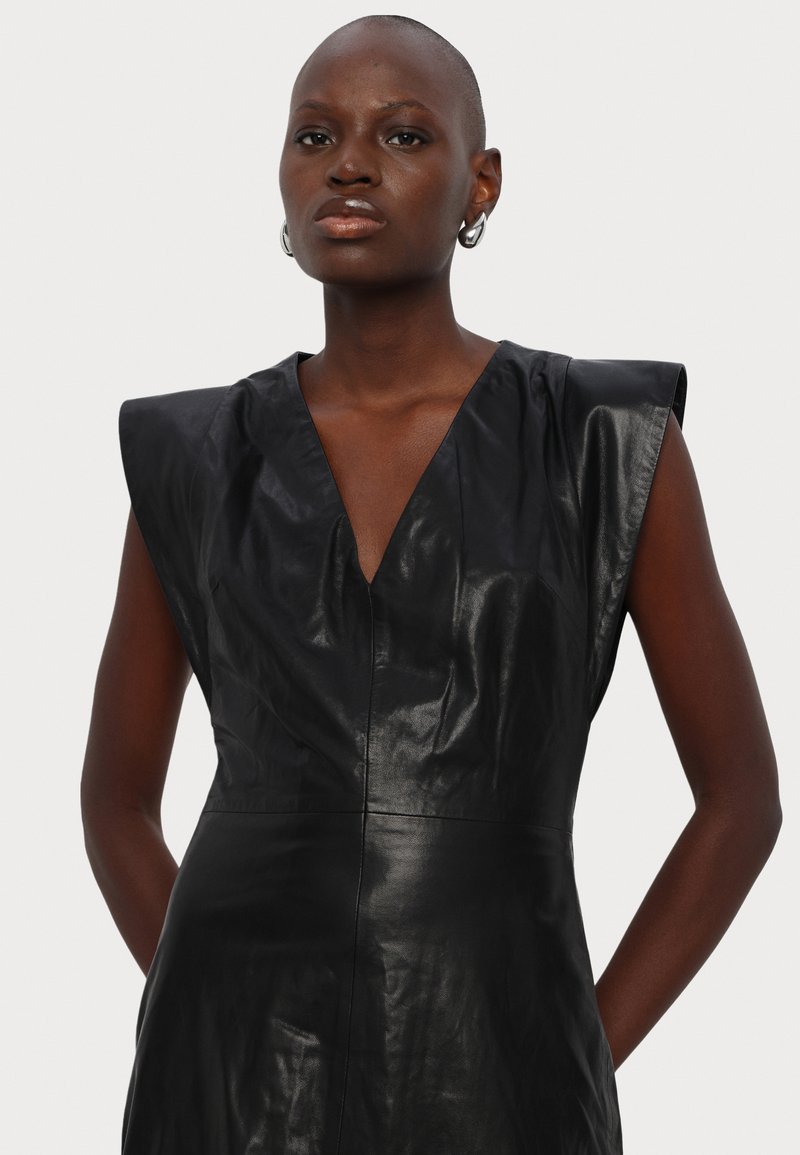 black peplum leather dress PEPLUM DRESS – Love Your Curves Shop main image 1