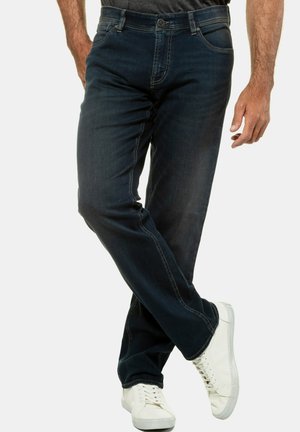 Dark blue denim jeans with a straight fit, featuring contrast stitching, five pockets, and a front button closure. Worn with white sneakers.