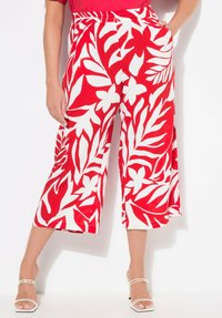 Rode en witte bloemen culottes met een relaxte pasvorm, voorzien van een wijde pijp, elastische tailleband en zijzakken. Soepele stof.