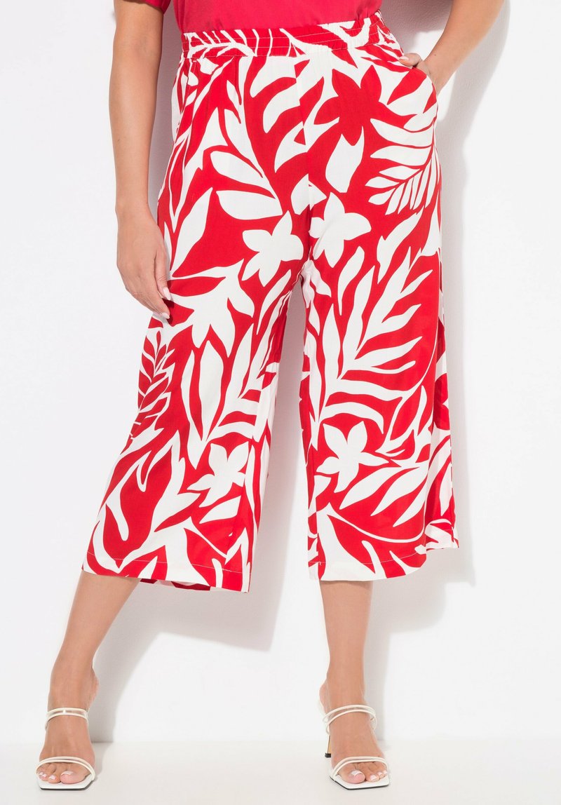Rode en witte bloemen culottes met een relaxte pasvorm, voorzien van een wijde pijp, elastische tailleband en zijzakken. Soepele stof.