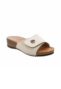 Sandale à glissière beige avec une semelle en liège, bout ouvert, large bride et accent en métal. Texture douce et léger talon pour le confort.