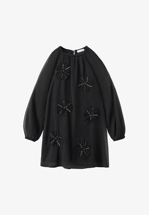 Robe transparente à manches longues noires avec des poignets froncés et cinq appliqués floraux texturés, chacun rehaussé de subtils sequins argentés.