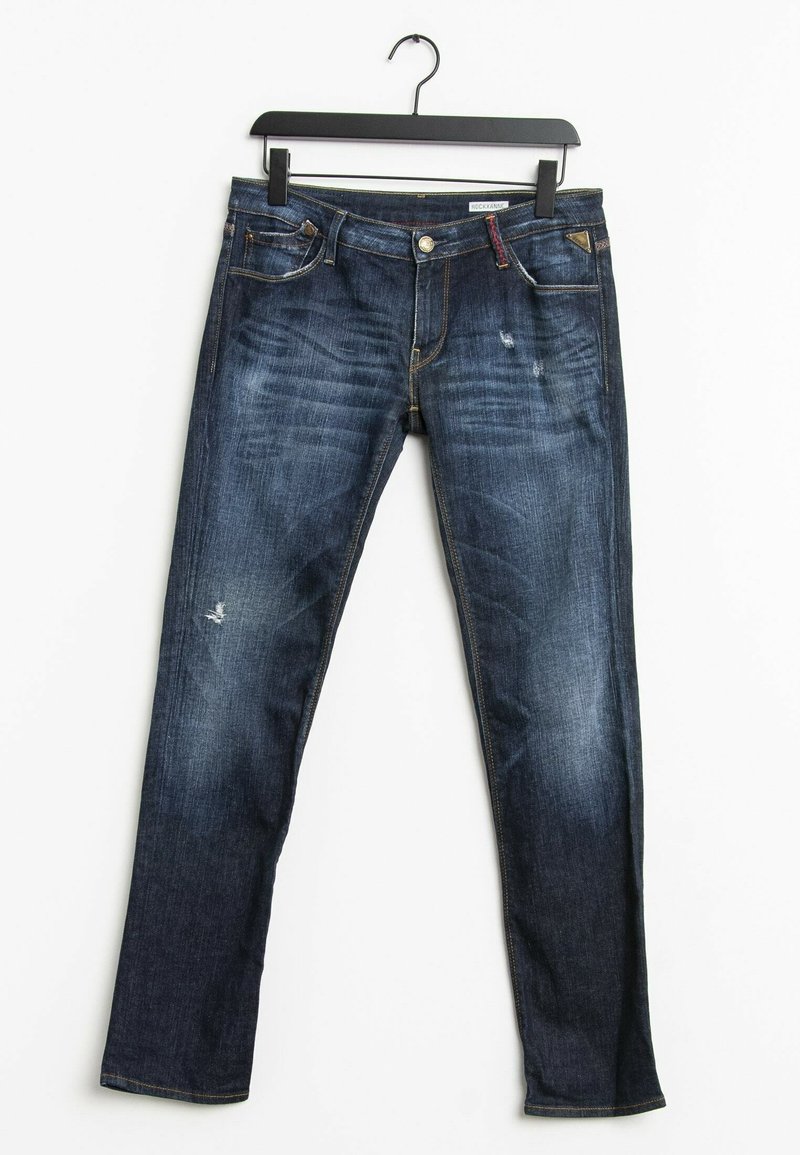 Jean slim bleu foncé avec légère usure et décoloration, suspendu sur un cintre noir sur fond blanc.