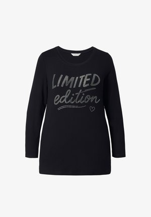 Czarna koszula z długim rękawem i okrągłym dekoltem z napisem "LIMITED edition" wysadzanym srebrnymi cekinami. Miękka bawełniana tkanina, luźny krój.