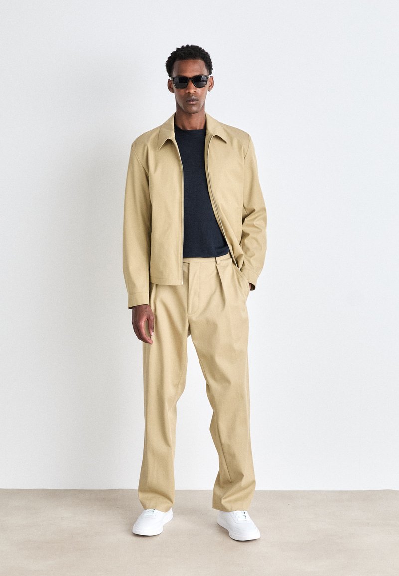 beige dress trousers BOSS BECKHAM X BOSS - Trousers - open beige/beige Ruffled One Shoulder Mini dressing tables Size:17W