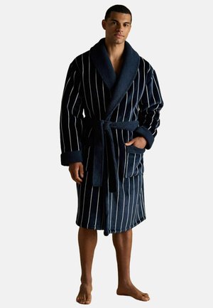 Navy blue striped bathrobe made of soft, thick fabric; features a shawl collar, waist tie, and front pockets with terry texture.