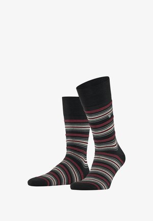 Chaussettes rayées aux couleurs noir, bordeaux et blanc avec un haut côtelé. Elles possèdent une semelle rembourrée et une texture lisse et douce.