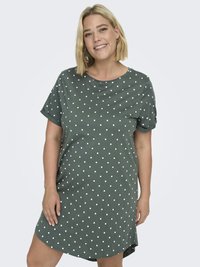 Kortärmad klänning i gröna prickar gjord av mjukt tyg. Har en rund halsringning och slutar strax ovanför knäet med en lätt A-linjeform.