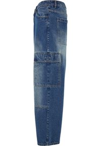 Denim cargo pants in medium blue with multiple pockets, visible stitching, and a straight-leg cut. Fabric appears soft with a slightly distressed texture.
