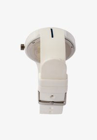 White silicone watch with a round face, metal crown, and a band featuring adjustable holes. Blue accent line near the crown.