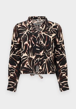 Long-sleeve button-up blouse with black and brown leaf pattern on beige background, featuring a front tie knot at the hem.