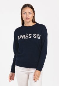 Marineblauer Pullover mit "APRÈS SKI" in Wei�ß gestrickt. Rundhalsausschnitt, lange Ärmel, gerippte Bündchen und Saum, weiche Textur, lässige Passform.