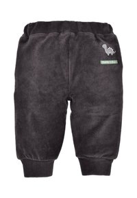 Pantaloni in corduroy grigio scuro con vita elastica, texture a coste e una piccola patch di un dinosauro. Presentano un'etichetta verde con la scritta "Daddy's Boy."