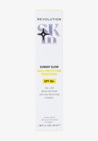 Emballage de crème solaire, blanc avec des accents holographiques, texte jaune indiquant "SPF 50 +", détails sur la protection UVA/UVB et la vitamine C, taille de 50 ml.
