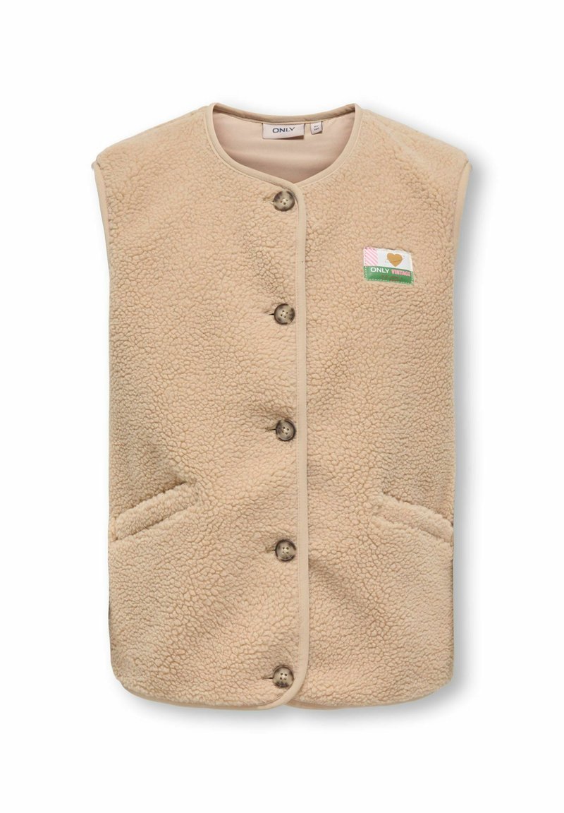 Beige flīsa veste ar pogu aizdari, divām sānu kabatām un mazu uzlika ar sirdi kreisajā pusē. Mīksta faktūra.