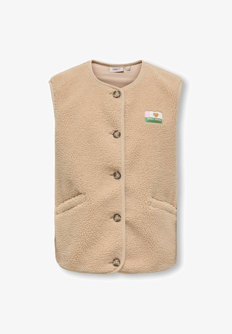 Beige fliisist vesti, millel on nupuvajutusega sulgemine, kaks küljetaskut ja väike südame motiiv vasakul poolel. Pehme tekstuur.