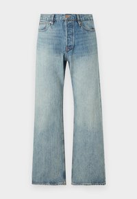 Svijetloplave traperice s izrezom, visokog struka, bakrenim detaljima, pet džepova i suptilnim izbleđenjem za izgled istrošenosti.