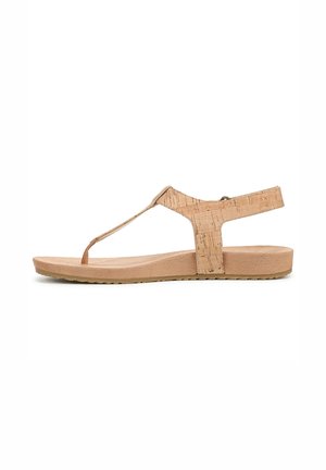Cork sandals with a T-strap design, beige color, soft textured footbed, flat sole, and an adjustable back strap for secure fit.