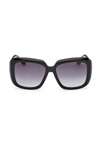 Lunettes de soleil carrées noires surdimensionnées avec des montures épaisses brillantes et des verres dégradés gris foncé.