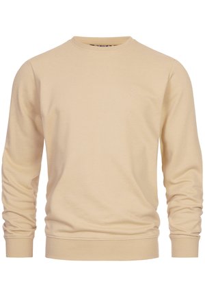 Jasno beżowy sweatshirt wykonany z bawełny. Posiada okrągły dekolt, długie rękawy oraz prążkowane mankiety i dół. Dyskretne logo na piersi.