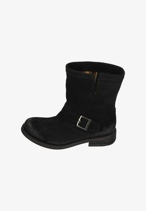 Black suede ankle boot with side buckle detail and low stacked heel, featuring a short shaft and slight front slit.