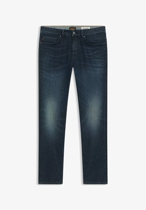 Dark blue denim jeans feature a straight-leg design, light fading at the thighs, and a leather patch on the back with logo detailing.