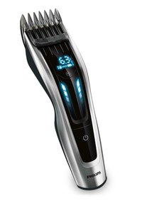 Philips haarknipapparaat met een slank zilver-zwart ontwerp, LED-display, verstelbare lengtestanden en een kamopzetstuk.