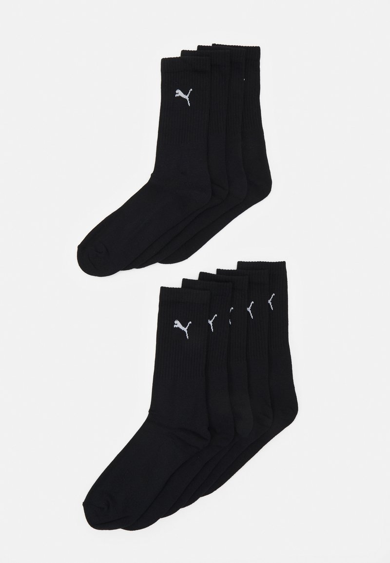 Paket šestih črnih bombažnih nogavic z rebrastimi manšetami in belim logotipom Puma. Enostaven dizajn, srednje dolžine, gladka tekstura.