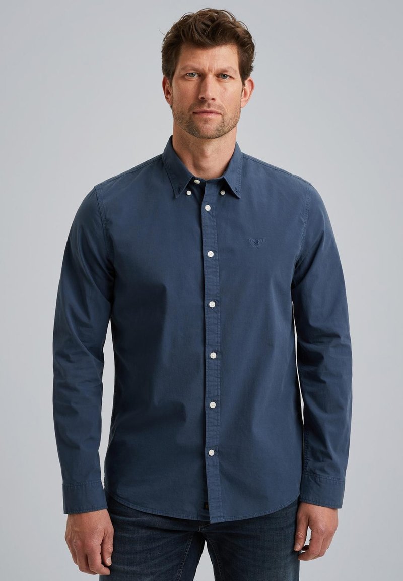 Navyblaues Button-Down-Shirt mit Kragen, langen Ärmeln und weißen Knöpfen. Verfügt über ein gesticktes Logo auf der linken Brust. Glattes Baumwollgewebe.