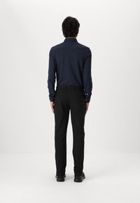Tommy Hilfiger DENTON TECH CHINO - Chinos - black