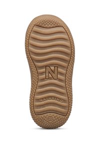 Gummisohle in Beige mit einem strukturierten Wellenmuster und kreisförmigen Griffpunkten; verfügt über ein geprägtes "N" und das Branding "NATURINO".