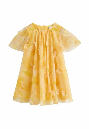 Robe fleurie jaune avec des manches bouffantes transparentes. Le tissu présente une texture douce et légère ainsi qu'un design fluide avec un corsage froncé.