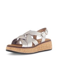 Silver metallic platform sandal with crisscross straps, cork sole, and ankle strap. Flat rubber outsole for grip and comfort.