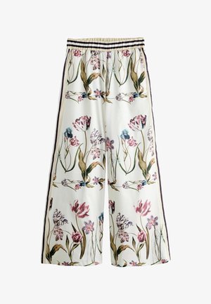 White wide-leg pants with elastic waistband, featuring vertical side stripes and a multicolored floral pattern with tulips and leaves.