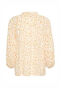 Blouse florale en tissu doux et léger. Dotée d'un col haut et de manches bouffantes. Palette de couleurs comprenant du blanc avec des motifs orange et jaune.