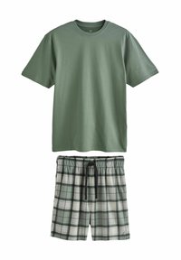 Grünes Baumwoll-T-Shirt mit Rundhalsausschnitt, kombiniert mit karierter Shorts in Grün, Schwarz und Weiß, mit elastischem Bund und Kordelzug.