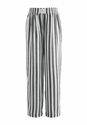 Black and white vertical striped loose-fit pants with elastic waistband and a small stitched label at the front center.