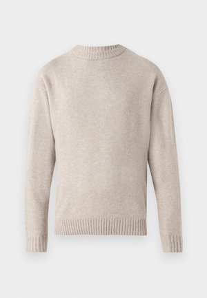 Bež pletena jopica z okroglim izrezom, rebrastimi manšetami in robom ter mehko teksturo. Ima sproščen kroj in dolge rokave.